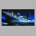 Sinking ship with illuminated lights on a dark water background